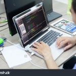 stock-photo-asian-developer-using-laptop-computer-sitting-working-real-office-331439570